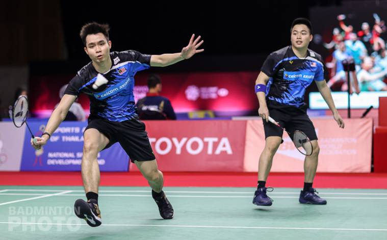 Aaron Chia/Soh Wooi Yik (Malaysia) berusaha menggapai pengembalian lawan. (Copyright: Badmintonphoto | Courtesy of BWF) Aaron Chia/Soh Wooi Yik (Malaysia) berusaha menggapai pengembalian lawan. (Copyright: Badmintonphoto | Courtesy of BWF)